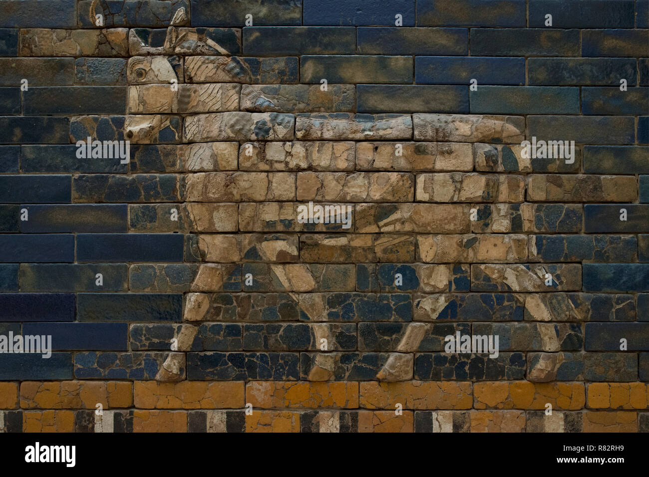 An animal relief depicting an aurchs. Detail of the glazed facade from the reconstructed Ishtar Gate (Babylon) in the Pergamon Museum in Berlin. Stock Photo