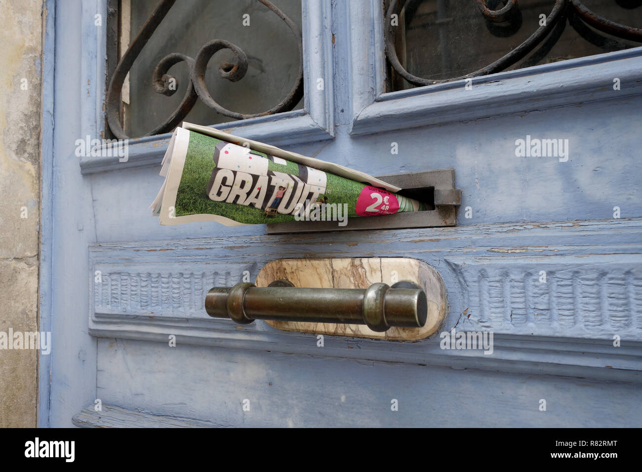 Free newspaper in letterbox France Stock Photo