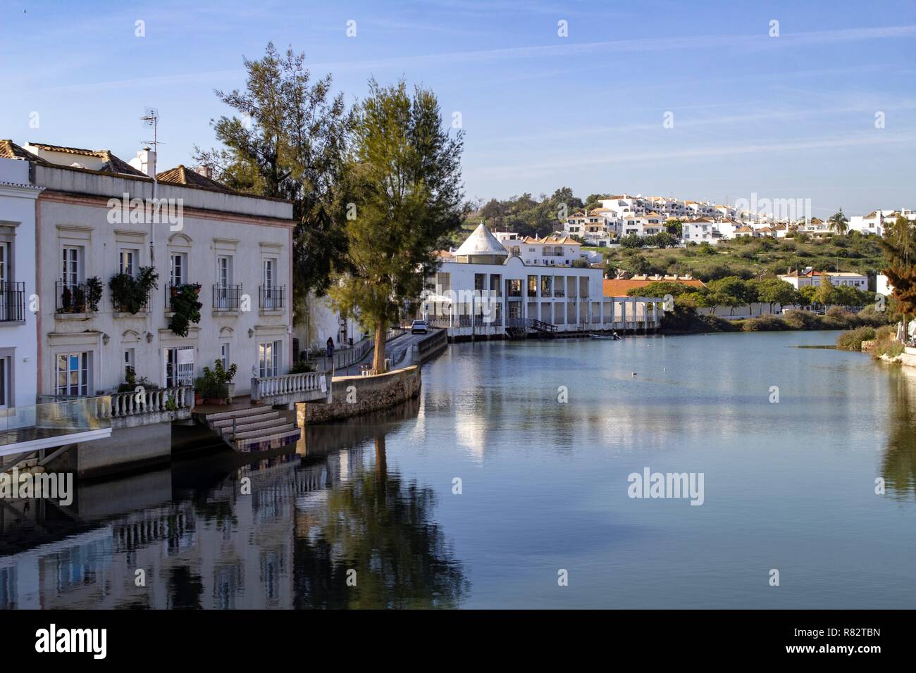 Tavira, Portugal. The quayside along the River Gilão in Tavira,Portugal with a view of the city in the background. Stock Photo