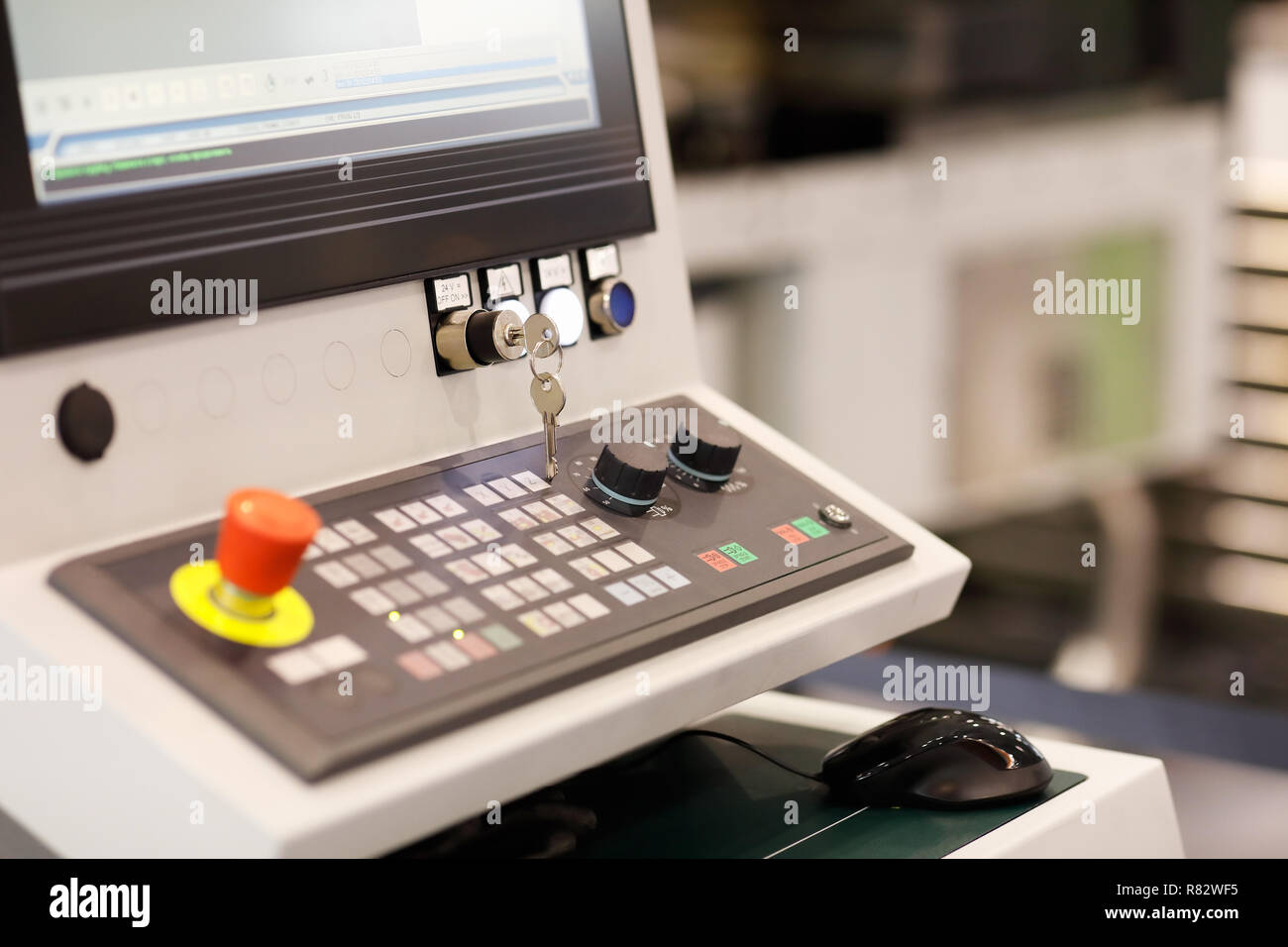 Control panel of multi axis CNC machining center. Selective focus. Stock Photo