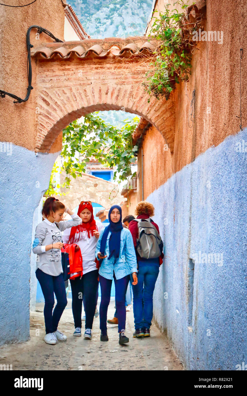 Chefchaouen, Morocco -  November 1, 2016: Girls on the way to school, on a street in Chefchaouen, Morocco Stock Photo