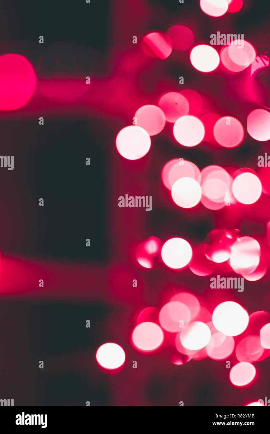 Red Christmas light bokeh create a magical setting Stock Photo