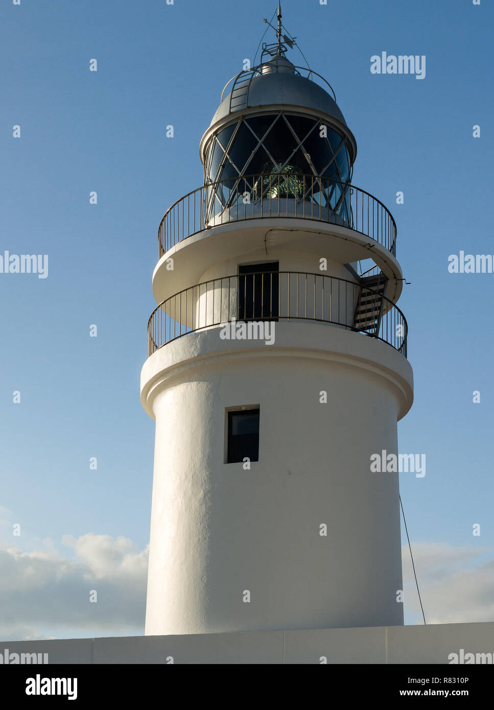Traditional white light house in a sunny day in Cap Cavallería, Menorca, Balearic Islands, Spain. Stock Photo