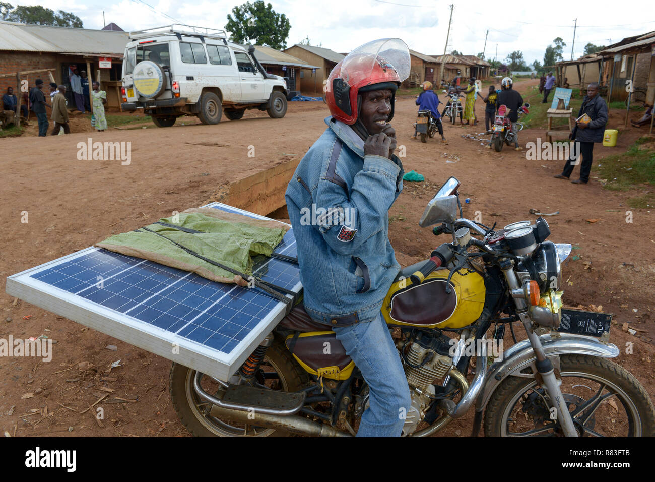 TANZANIA Tarime transport of PV solar panel by motorbike