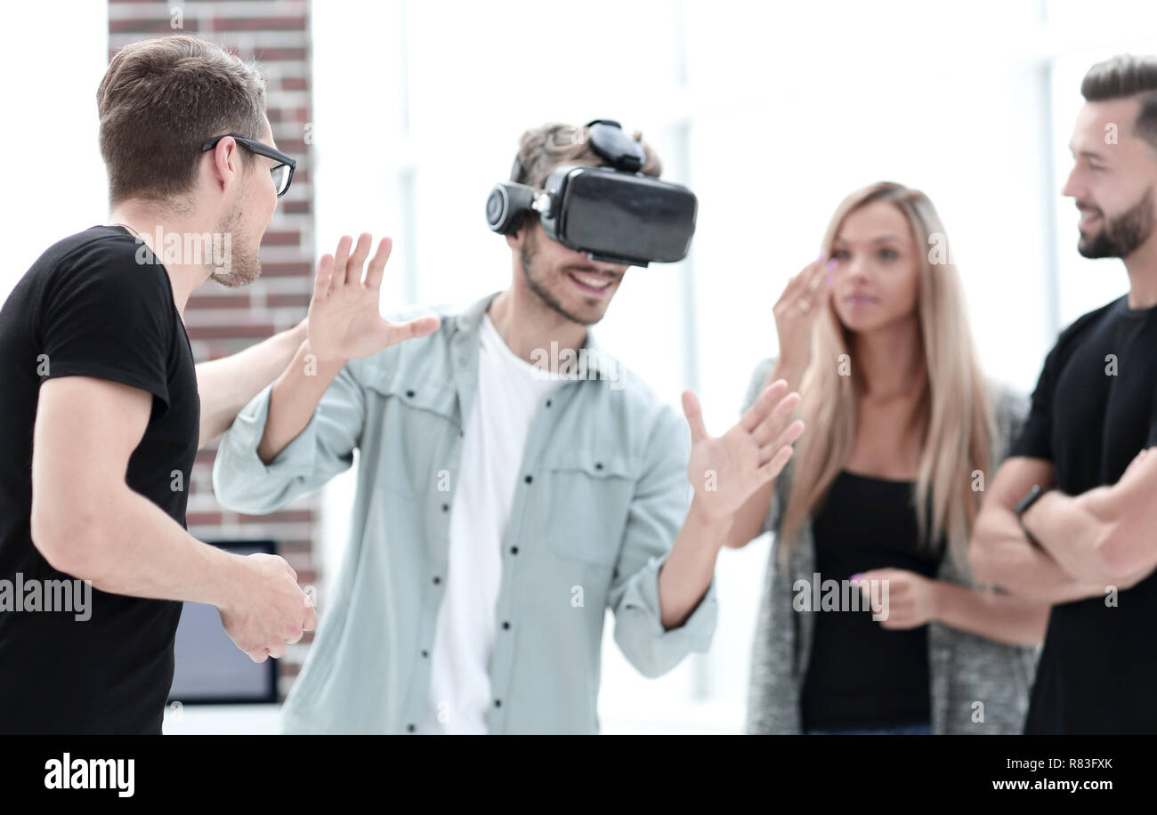 Positive colleagues testing virtual reality glasses Stock Photo