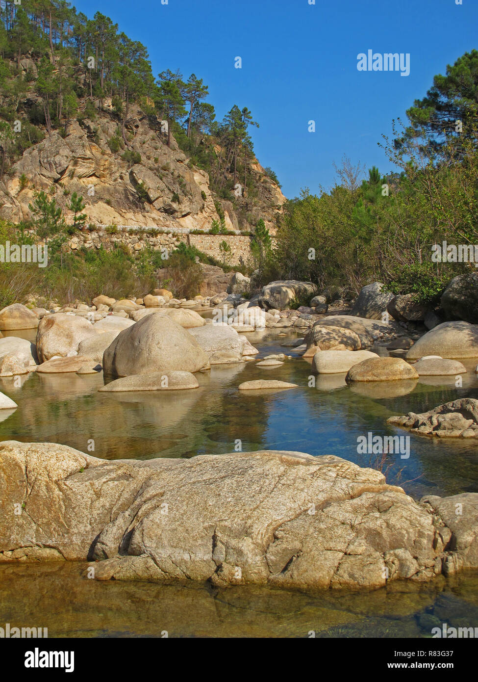 Round rocks in natural river pools of the Solenzara River on Corsica Stock Photo