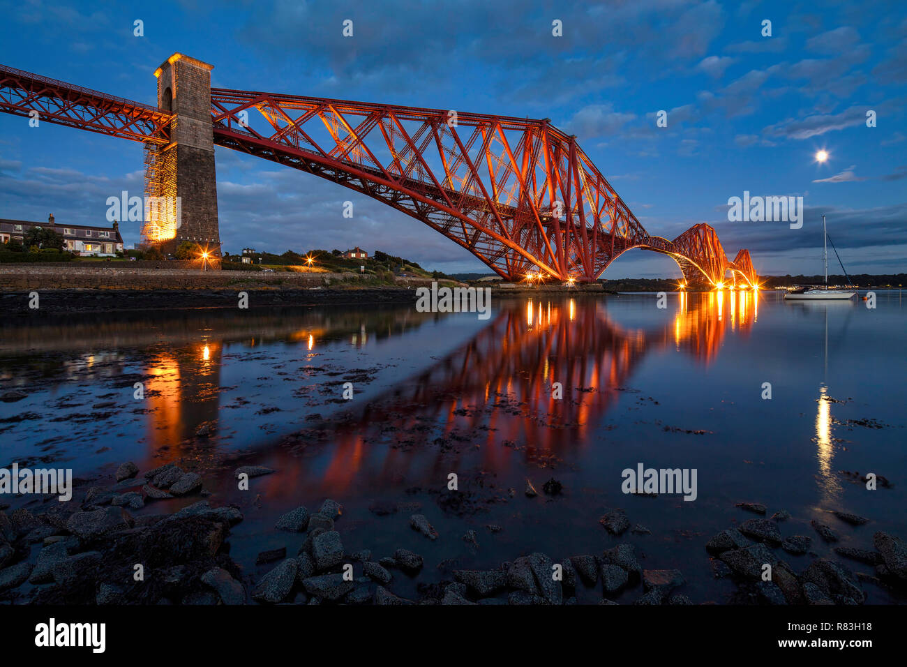 The Forth Bridge at night viewed from North Queensferry, Fife, Scotland, United Kingdom Stock Photo