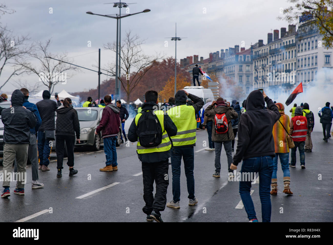 Yellow Vests (Gilets Jaunes) protesters who are against fuel tax, government, and French President Macron. Lyon, France. Stock Photo