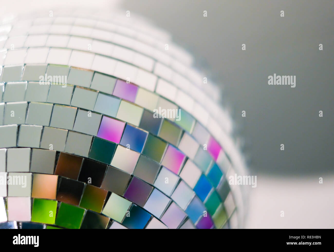 Close up view of colorful disco ball with multicolored reflections. Preparing for a fun night party or holiday at home Stock Photo