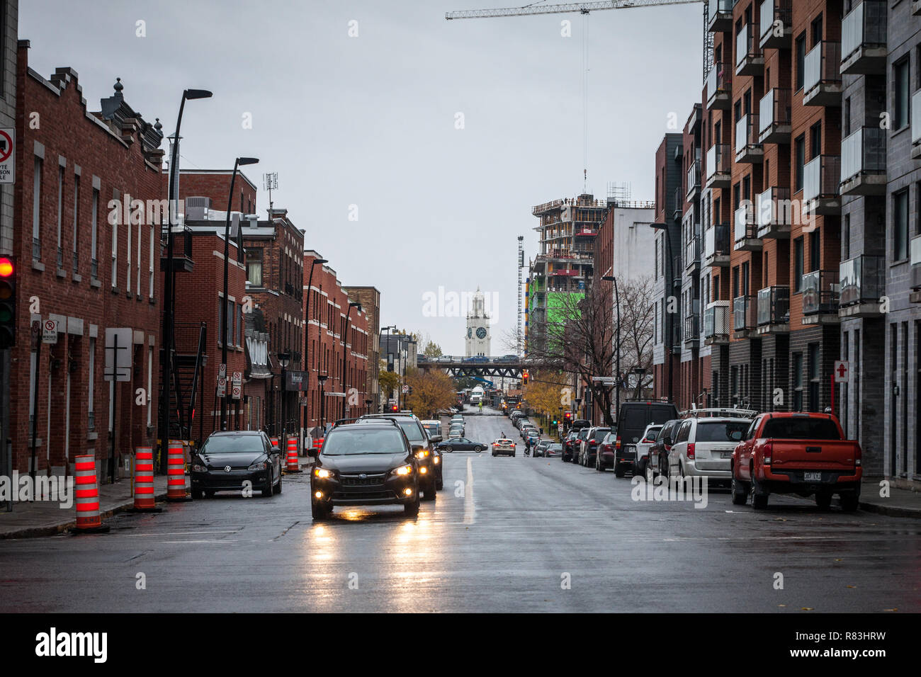 MONTREAL, CANADA - NOVEMBER 5, 2018: Typical residential North American street with typical red brick accomodation buildings & car traffic. Atwater Ma Stock Photo