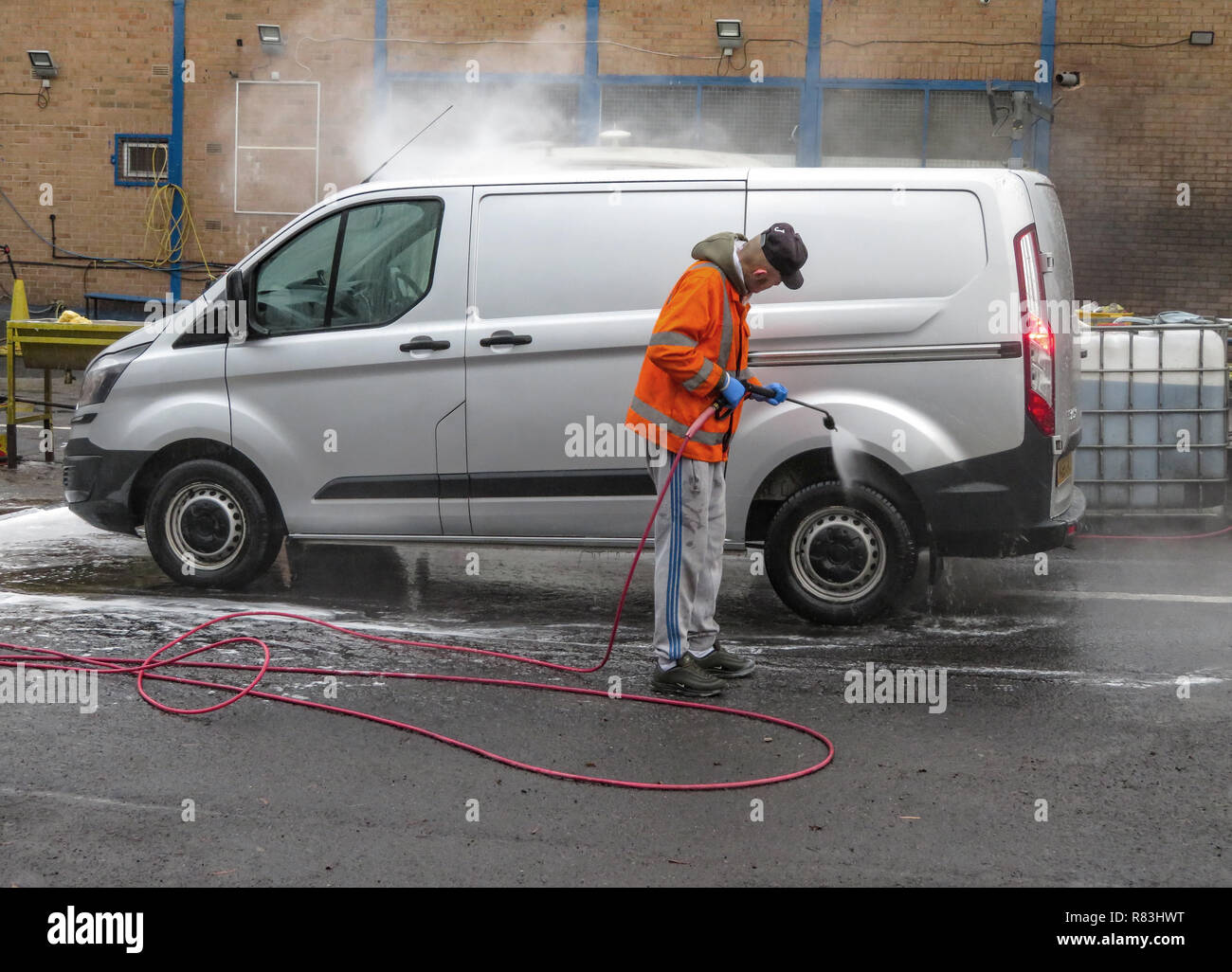 One man using Water Jet Spray to hand wash a vehicle in Rotherham