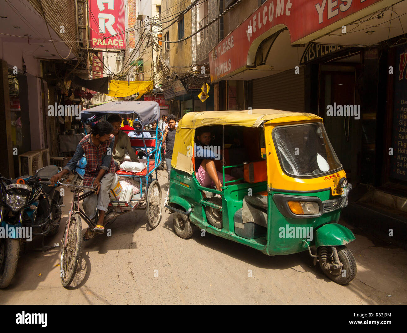 Street scene at Sangatrashan Bazar, Tuk Tuks the indian taxis at the narrow streets, New Delhi, India Stock Photo