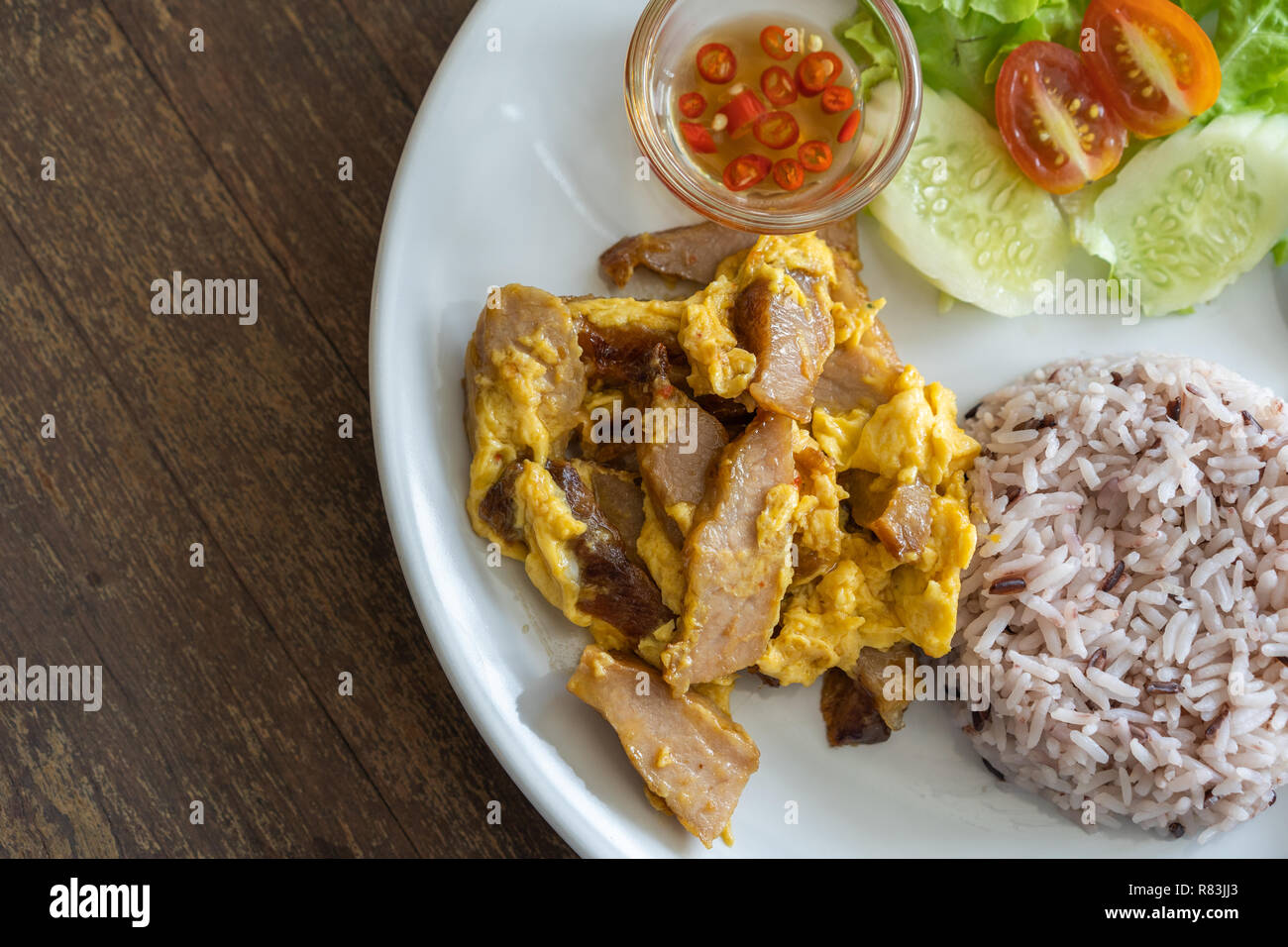 fried pork with egg and rice on plate Stock Photo