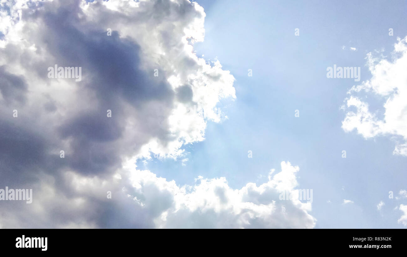 cumulus clouds like fluffy, white cotton balls on the blue sky