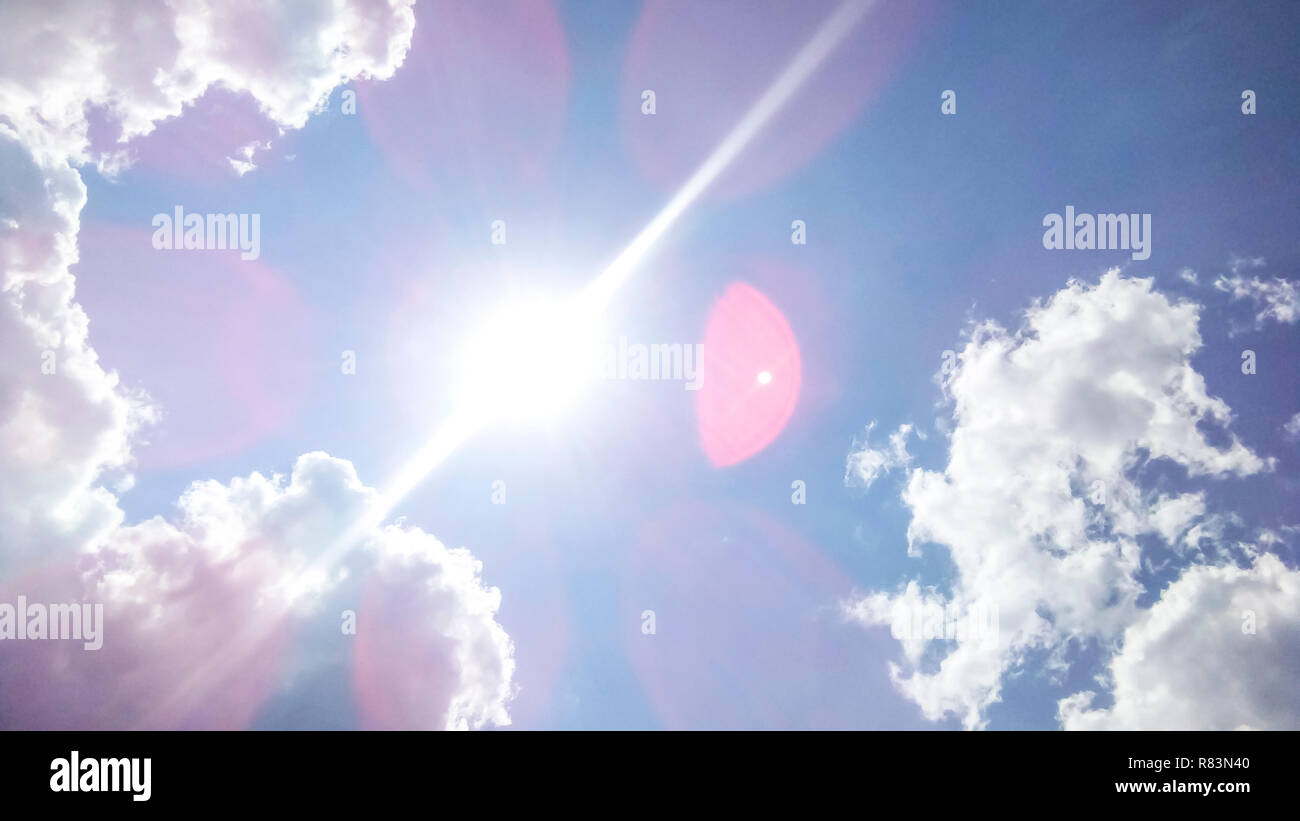 cumulus clouds like fluffy, white cotton balls on the blue sky