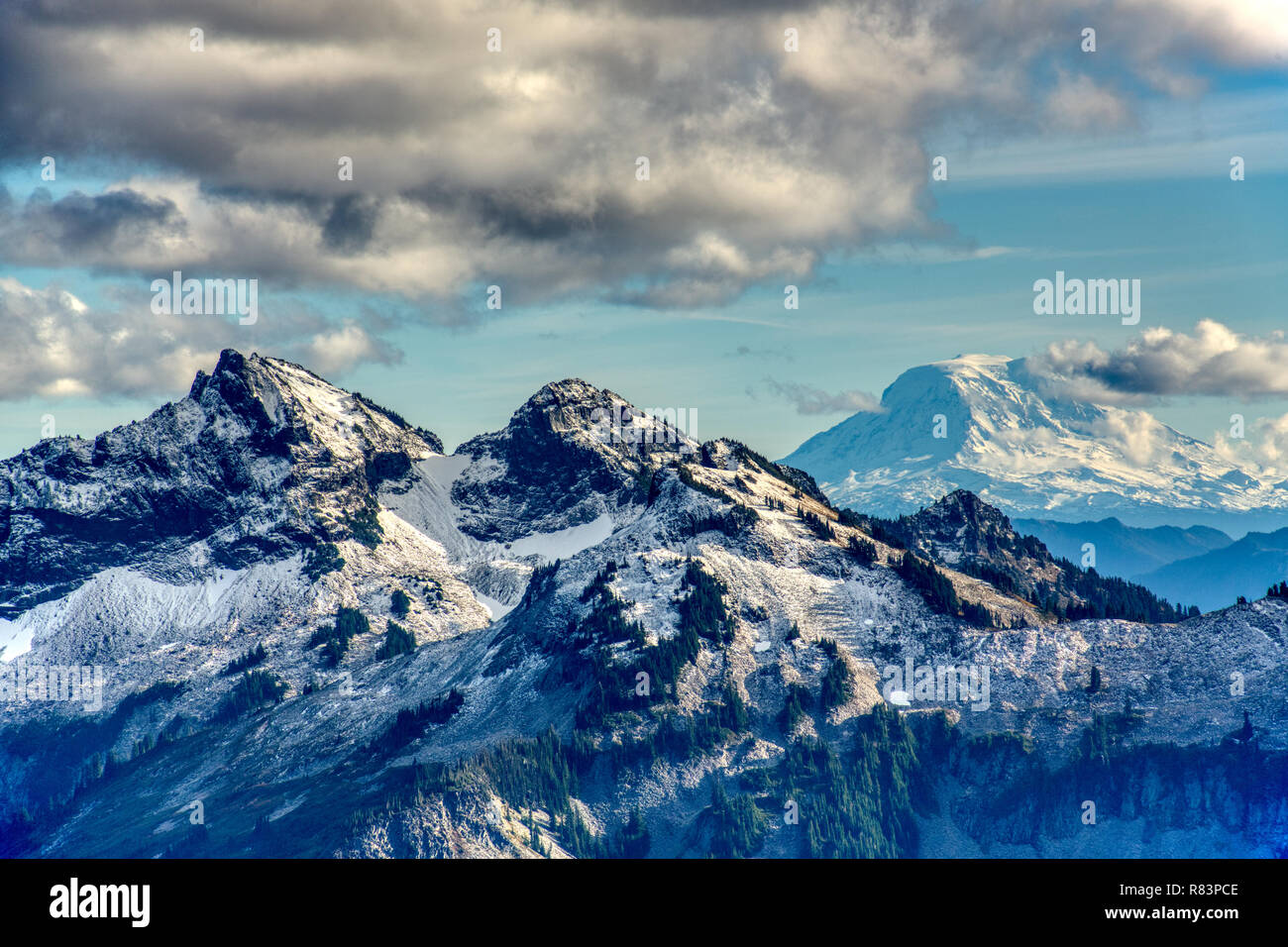 Sunset falls on the peaks of the Tatoosh Mountain Range (left) inside Mt. Rainier National Park