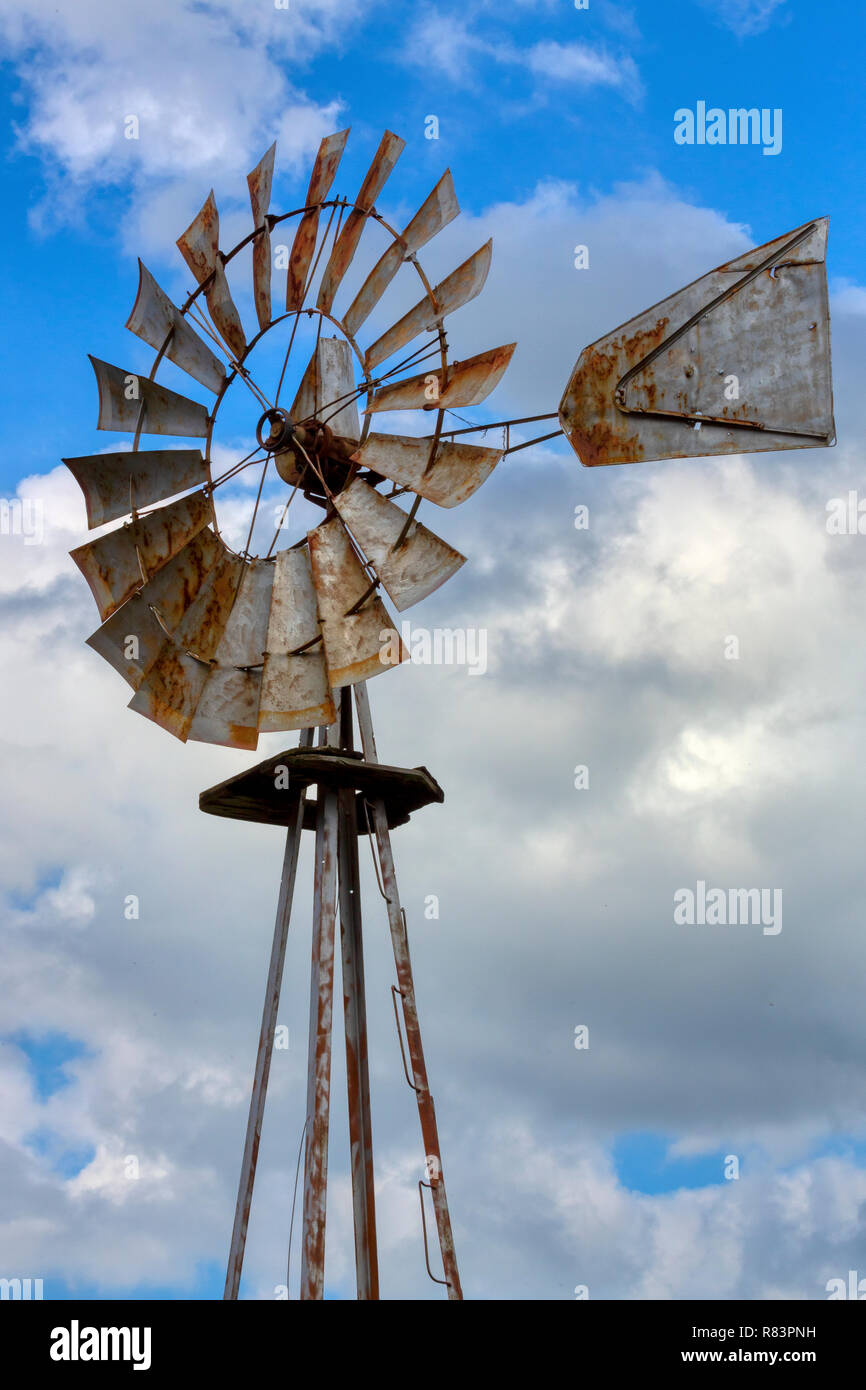 Oldfashioned windmill set against a bright blue autumn sky Stock Photo
