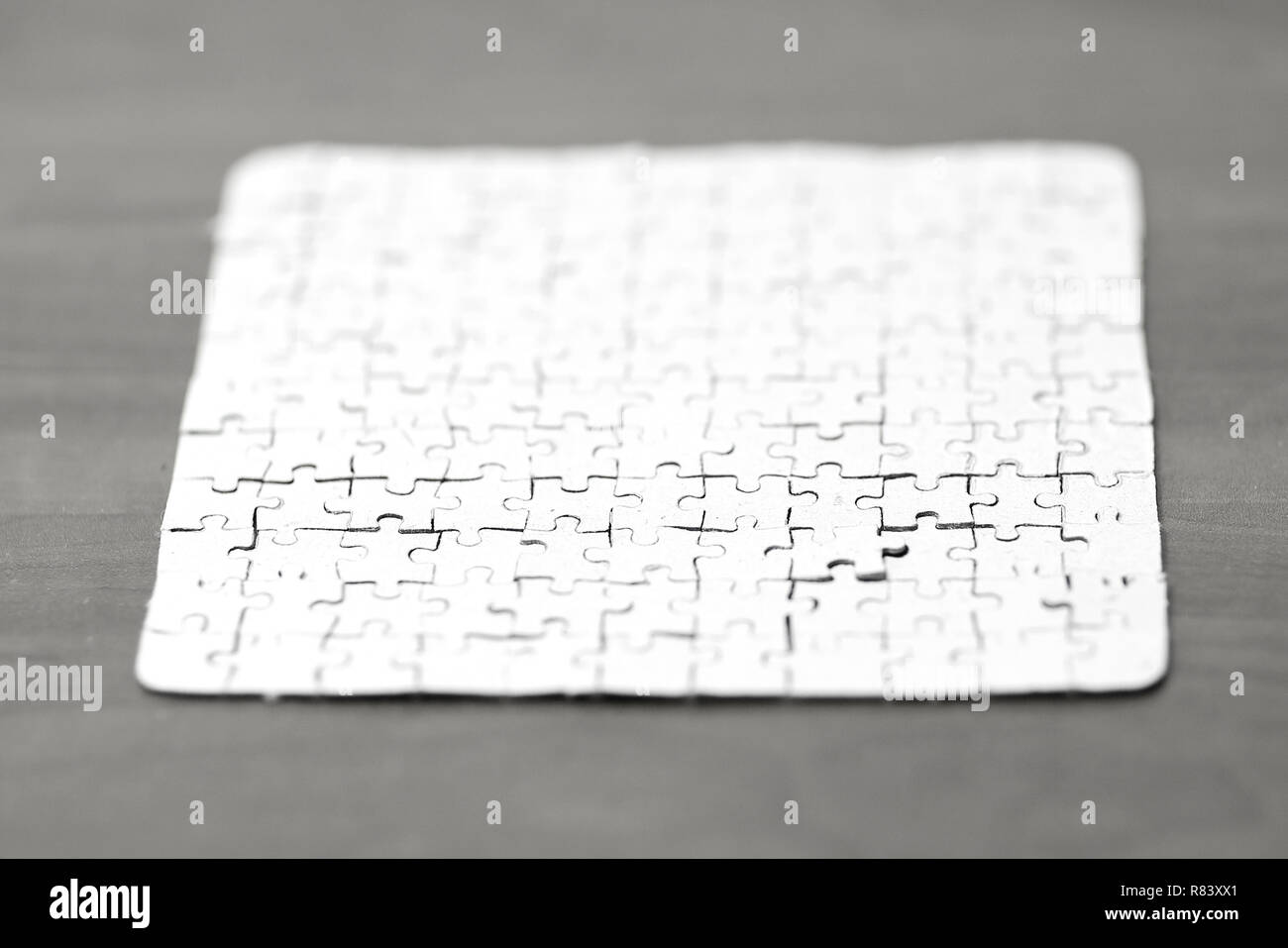 blank card collected from puzzle pieces on wooden background Stock