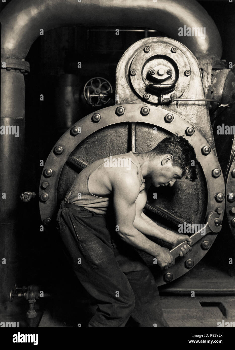 Lewis Hine (1874-1940) 'Power house mechanic working on steam pump' 1920. Vintage print. Records of the Work Projects Administration. (69-RH-4L-2) Stock Photo