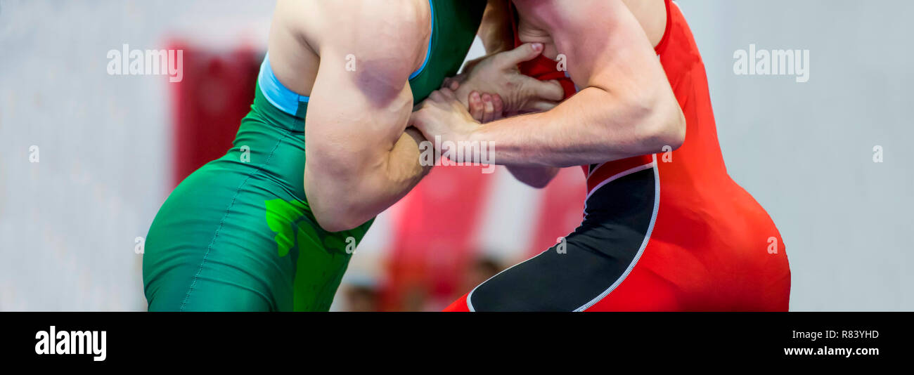 Two wrestlers Greco-Roman wrestling during competition Stock Photo