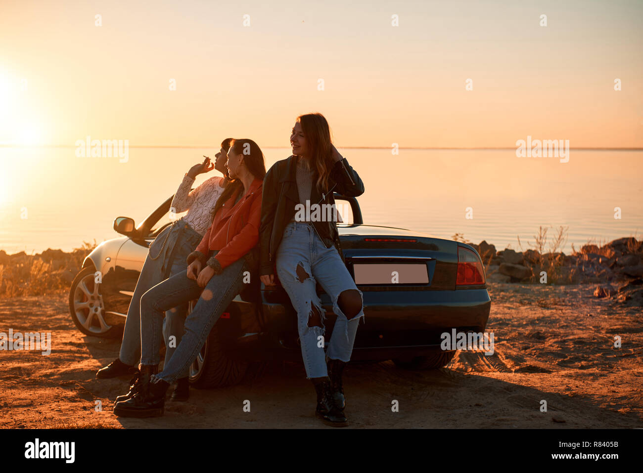 Three women standing hi-res stock photography and images - Alamy