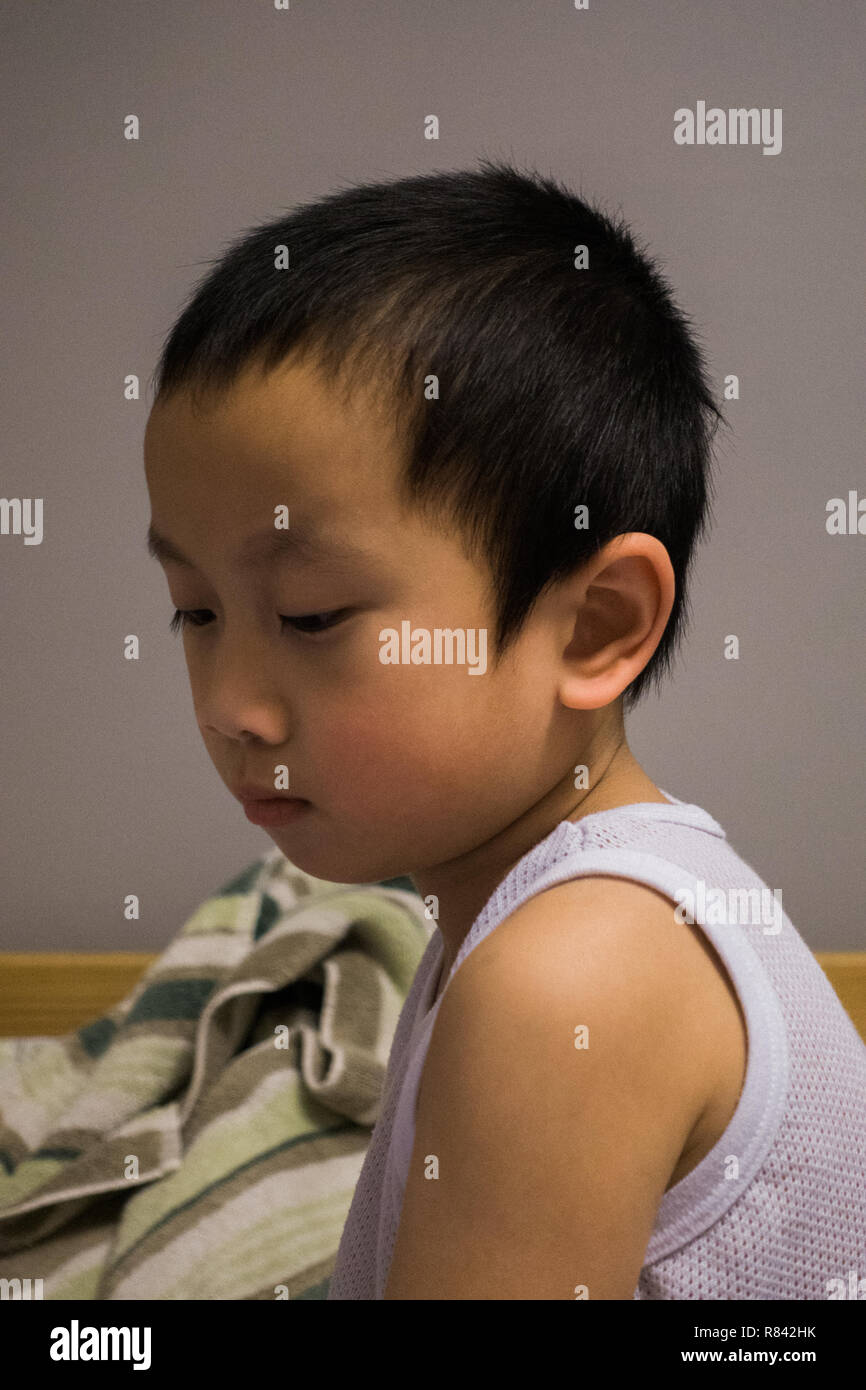Sleepy little Asian kid Stock Photo