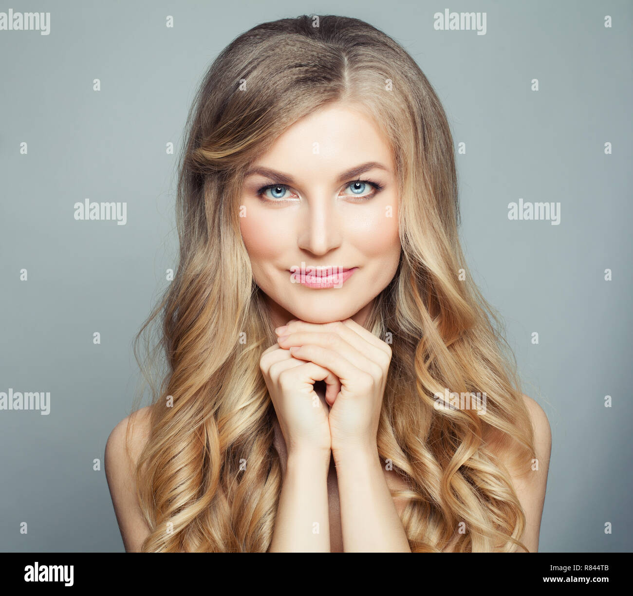 Natural Beauty Blonde Woman With Long Healthy Curly Hair And