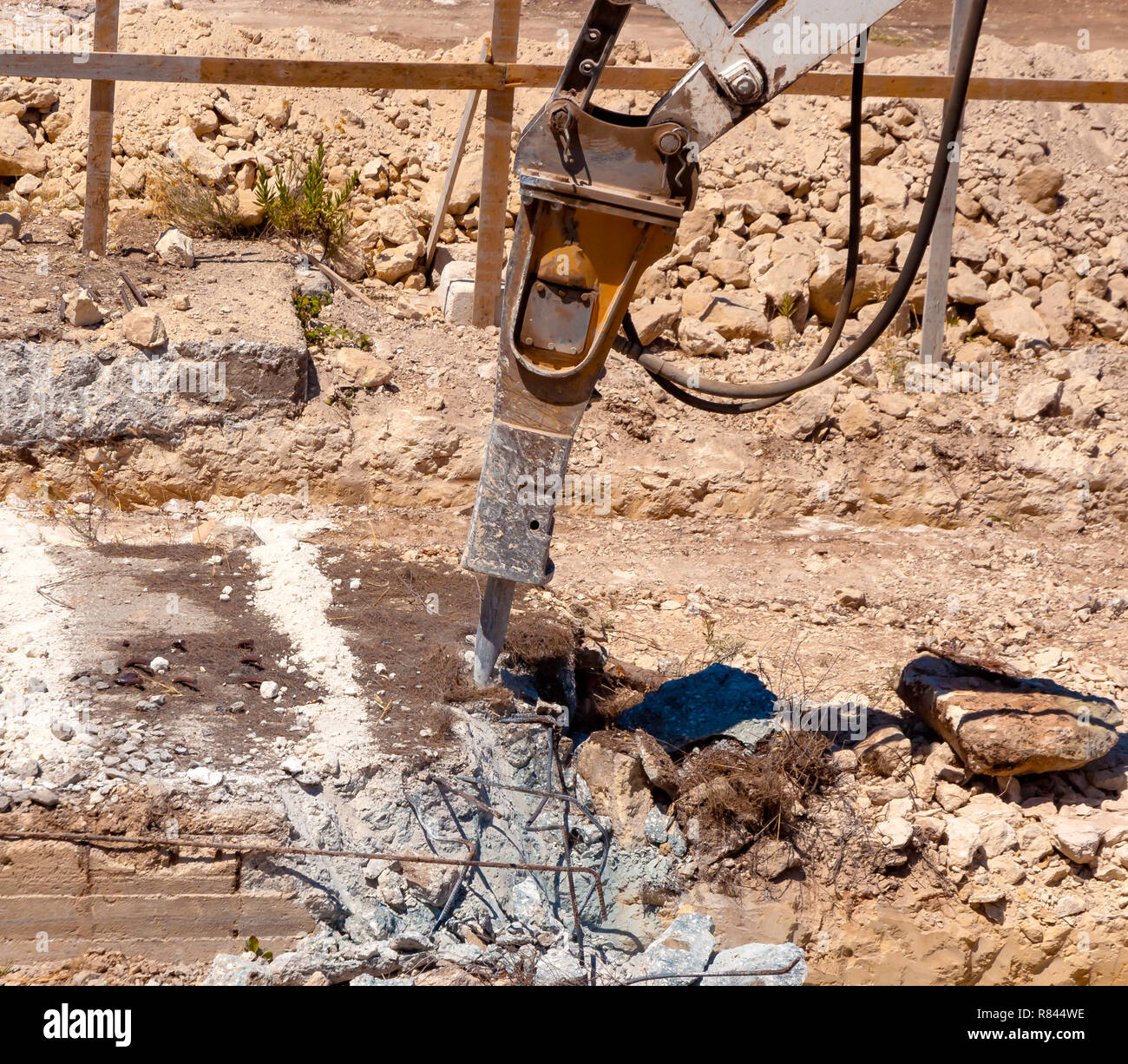 Excavator with demolition hammer in a construction site Stock Photo - Alamy