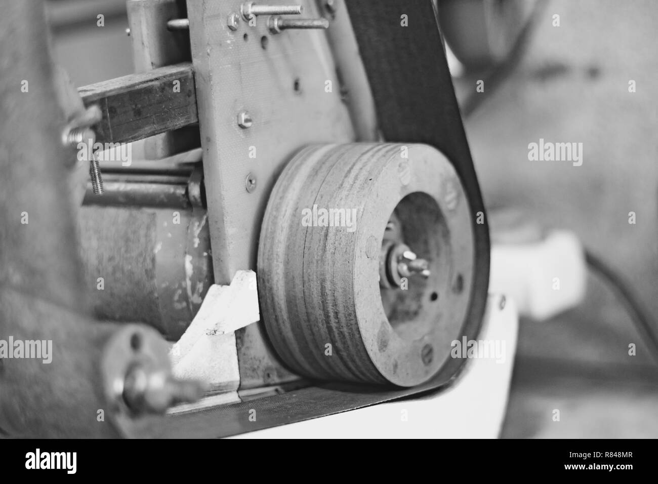 Old grinding machine and wheel in workshop or small factory blur background Stock Photo