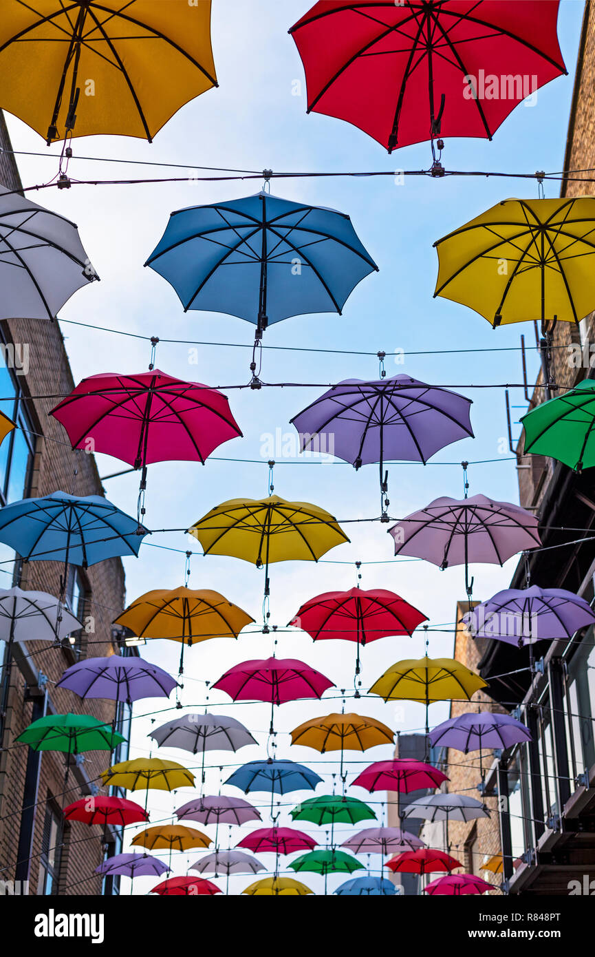 Ireland,Dublin, large group of  multi-coloured umbrellas hanging over a street as art installation Stock Photo