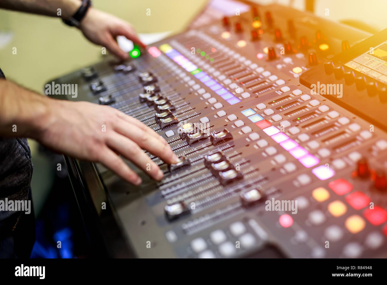 Person adjusting audio mixing console on music studio. Buttons of audio  sound mixer board Stock Photo - Alamy