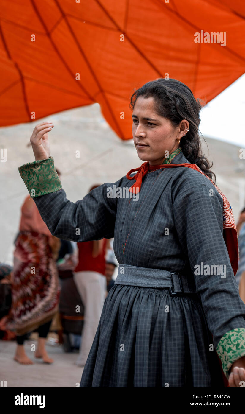 ladakhi woman in a traditional dress dancing during celebrations of his holiness dalai lamas birthday mulbekh ladakh jammu and kashmir india jul R849CW