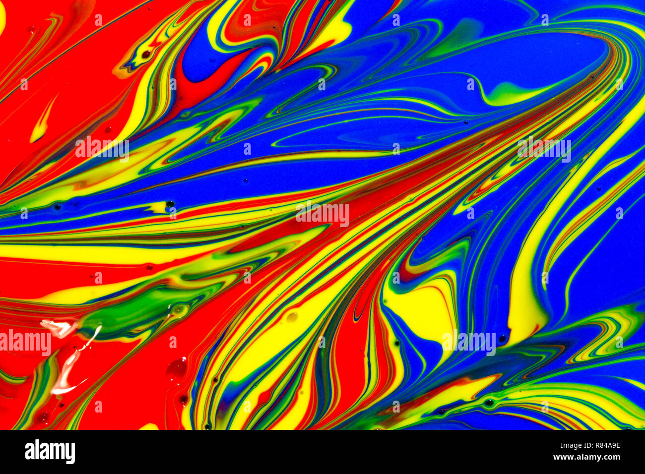 Multicoloured abstract background of red yellow green and blue liquid ...
