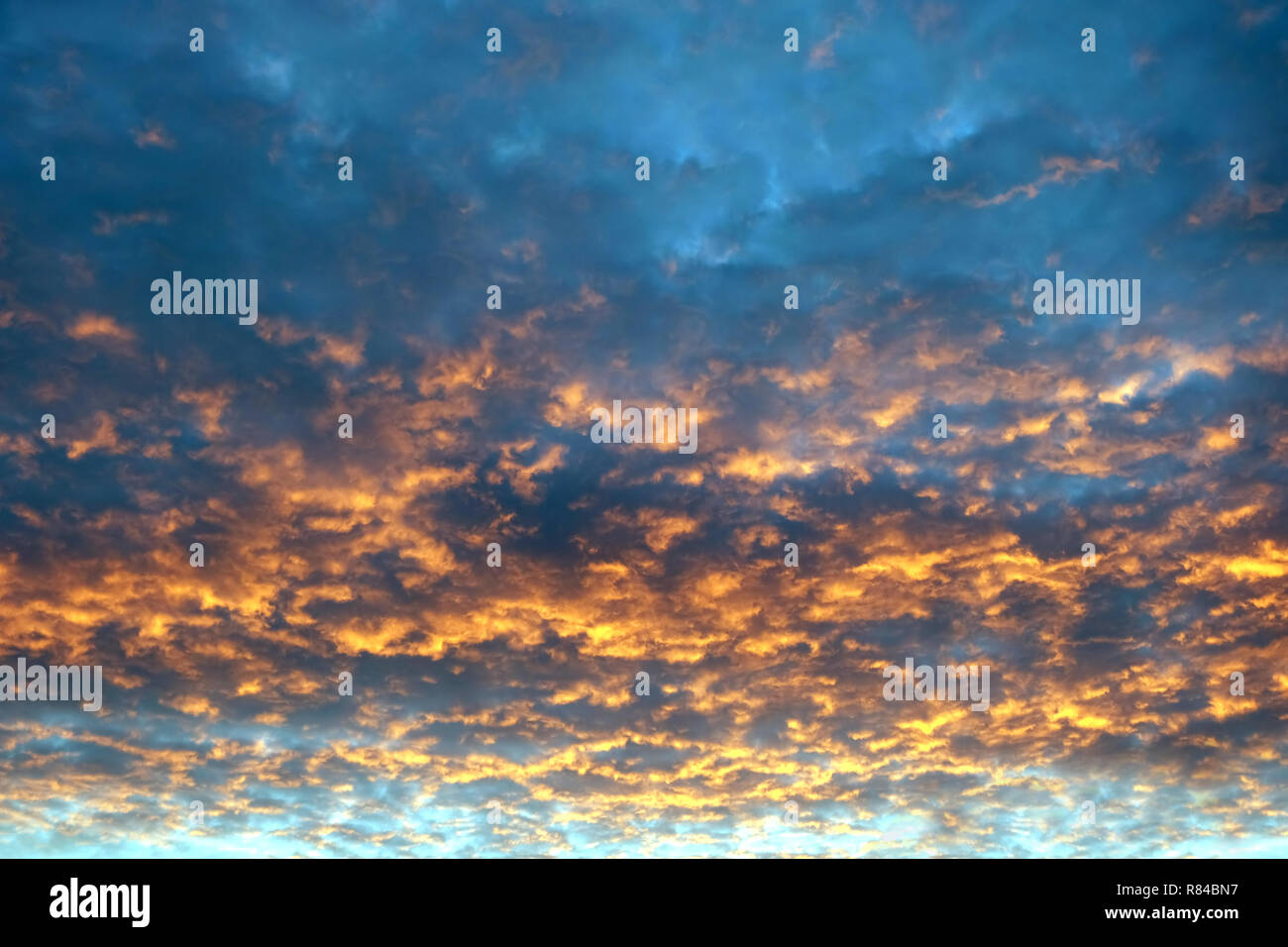 Beautiful colorful sunset sky with many flamy clouds in sunset ...