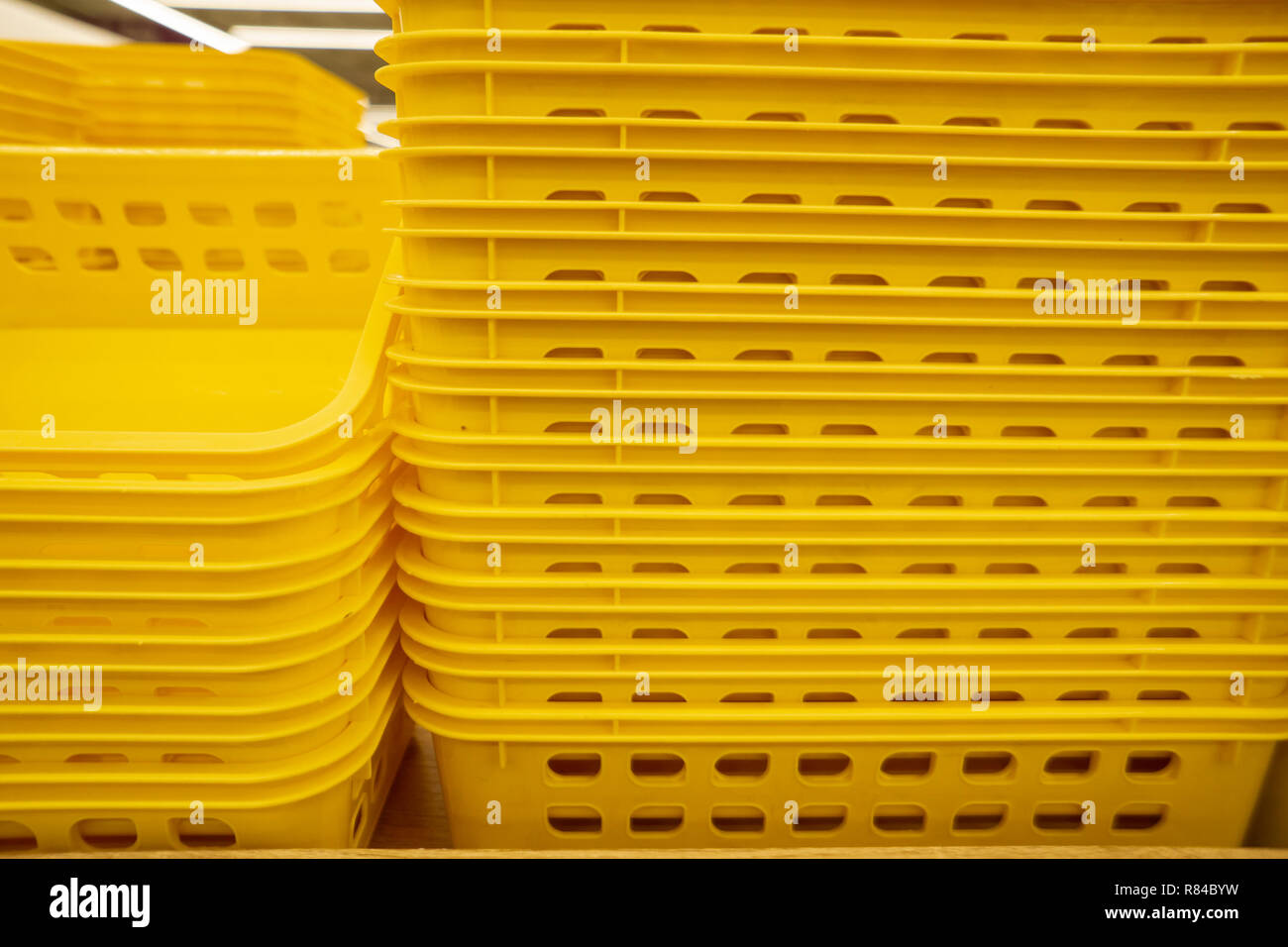 Colorful plastic boxes stacked one upon the other. Multicolored