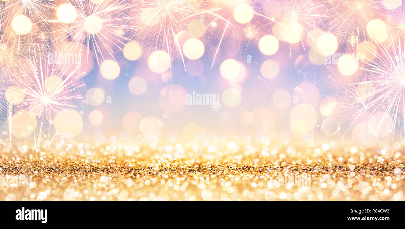 Shiny Golden Glitter With Fireworks And Lights Stock Photo