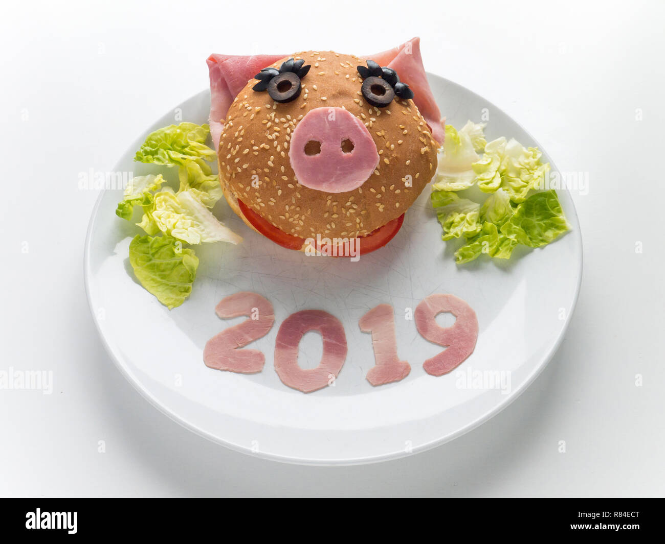 Children's burger, lettuce salad and 2019 digits made of the pork ham as a symbol of new year. Animal chinese horoscope. Funny female piglet sandwich Stock Photo - Alamy Children's burger, lettuce salad and 2019 digits made of the pork ham as a symbol of new year. Animal chinese horoscope. Funny female piglet sandwich Stock Photo - Alamy