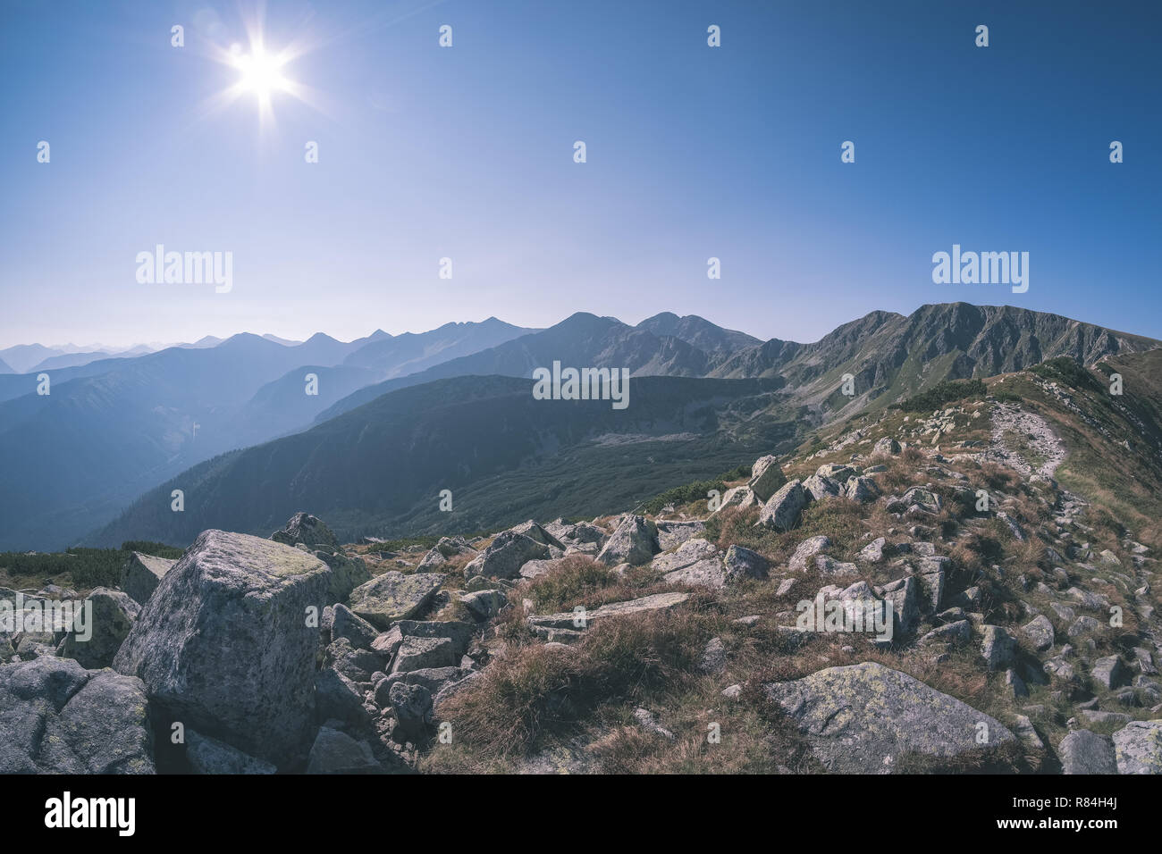 western carpathian mountain tops in autumn covered in mist or clouds ...