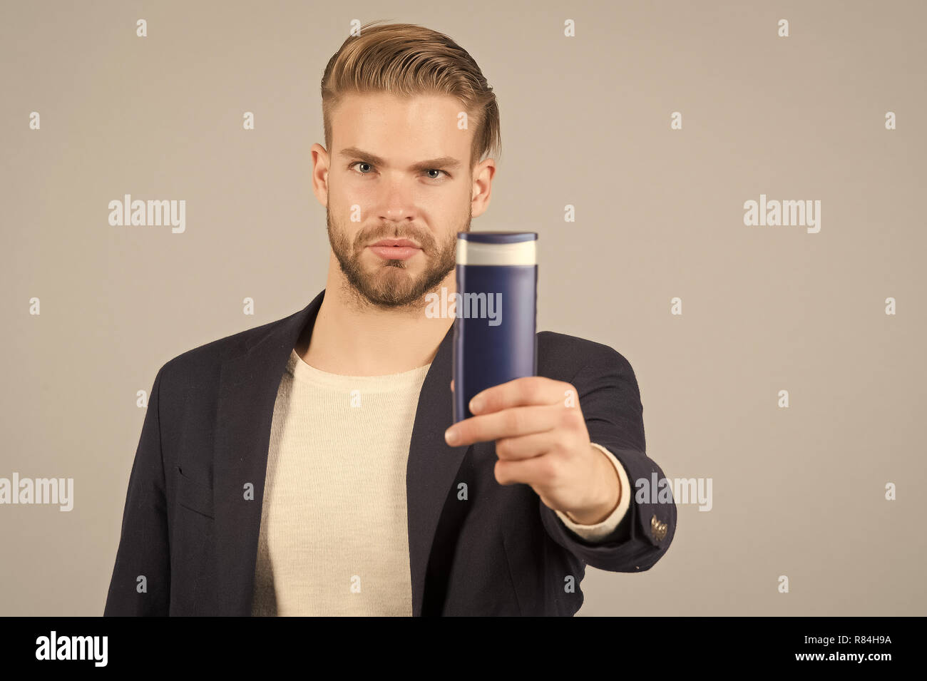 Businessman With Shampoo Or Gel Bottle In Hand Bearded Man With