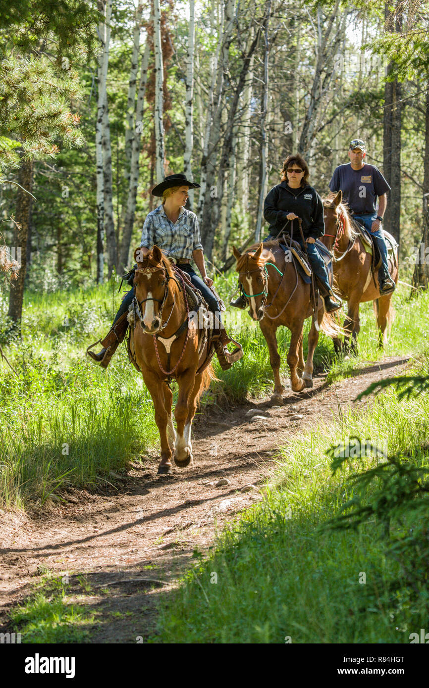People horseback riding on the Patricia Lake Circle trail near Jasper