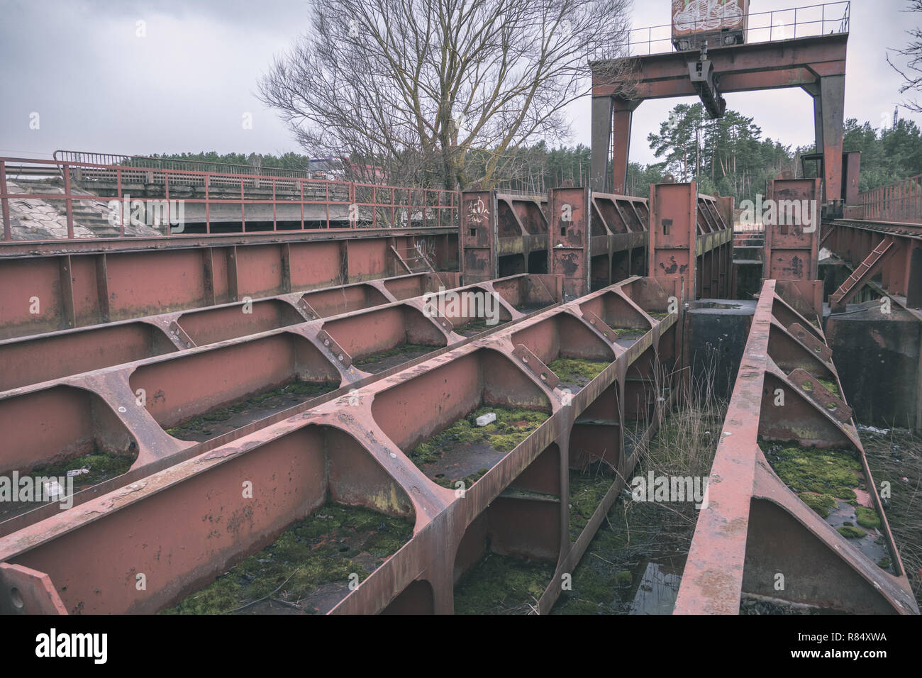 old red metal bridge over water. rusty details and close ups - vintage retro look Stock Photo