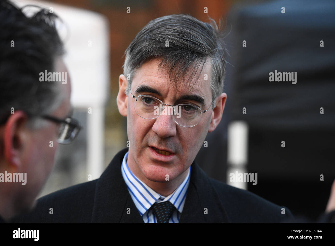 Jacob Rees-Mogg speaks to reporters on College Green in Westminster the morning after Prime Minister Therea May survived an attempt by Conservative MPs to oust her with a vote of no confidence. Stock Photo