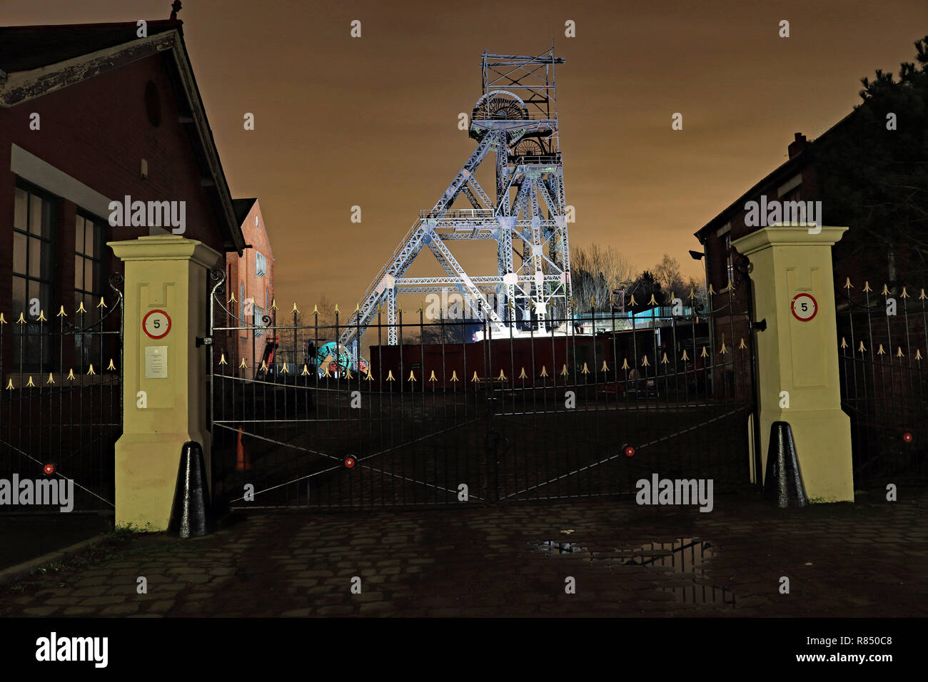Lit pit head gear and entrance gate to Astley colliery 11.12.18  The pit head gear at the Astley Mining museum lit up for a few weeks over Christmas Stock Photo