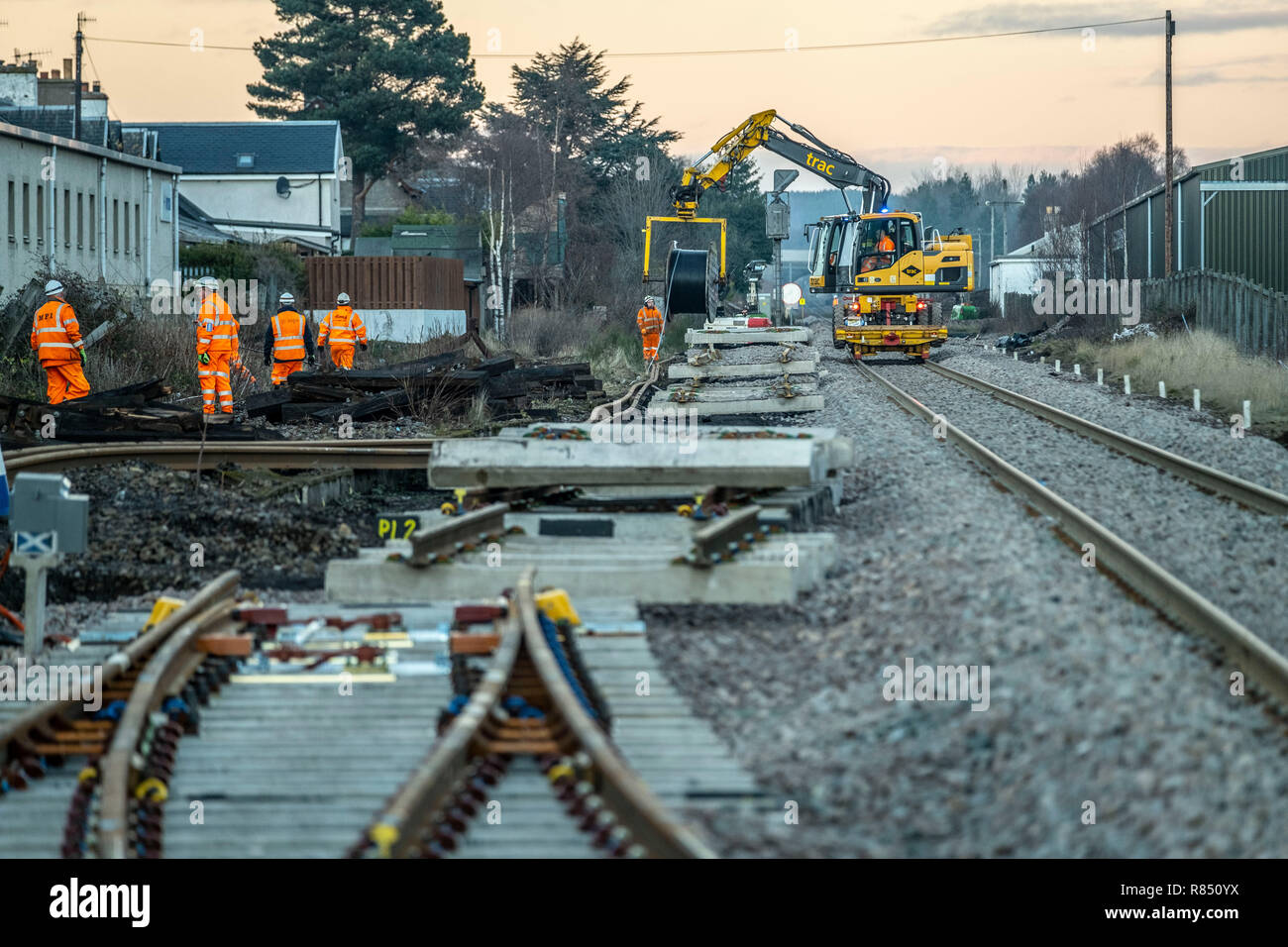 Rail workers laying new track, balls, installing points and laying