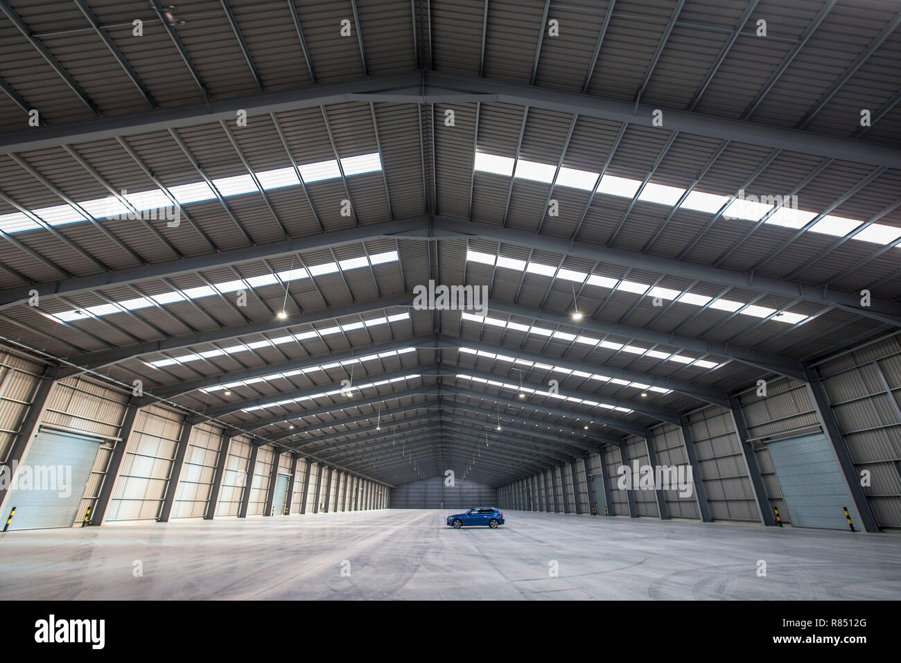 enormous empty warehouse space Stock Photo