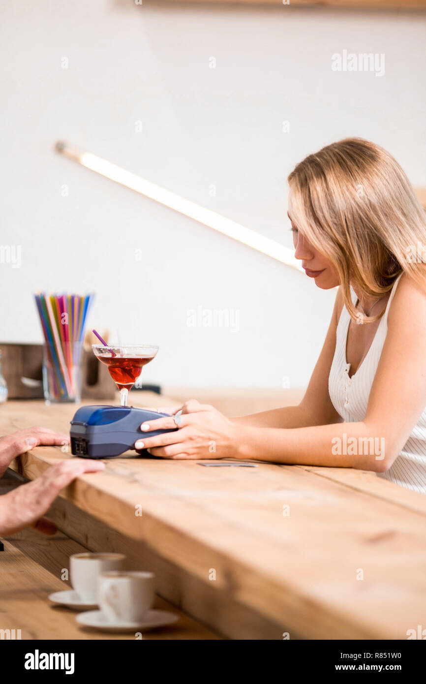 Paying by credit card in cafe Stock Photo