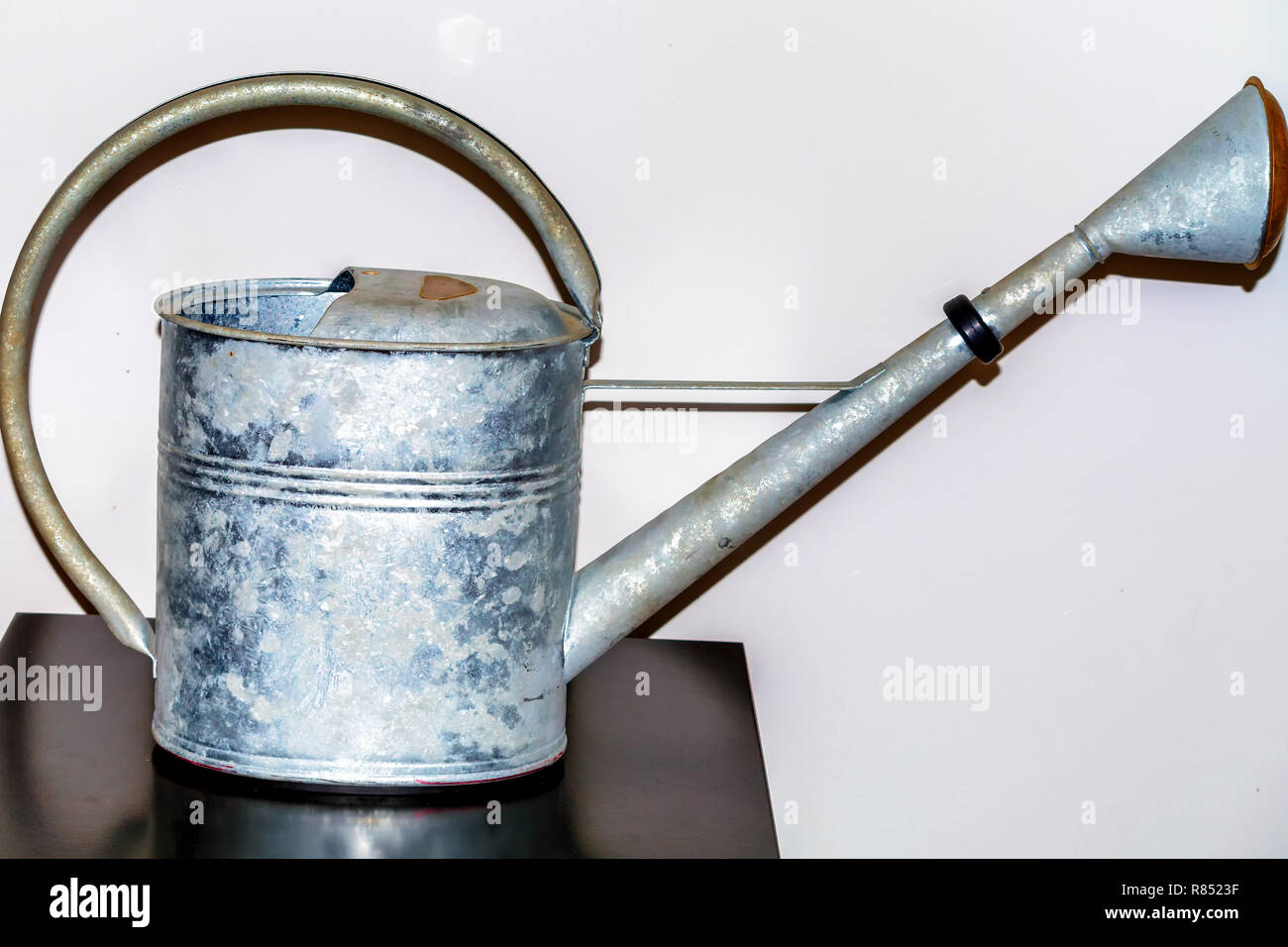 Zinc old metal watering can on a white background Stock Photo Alamy