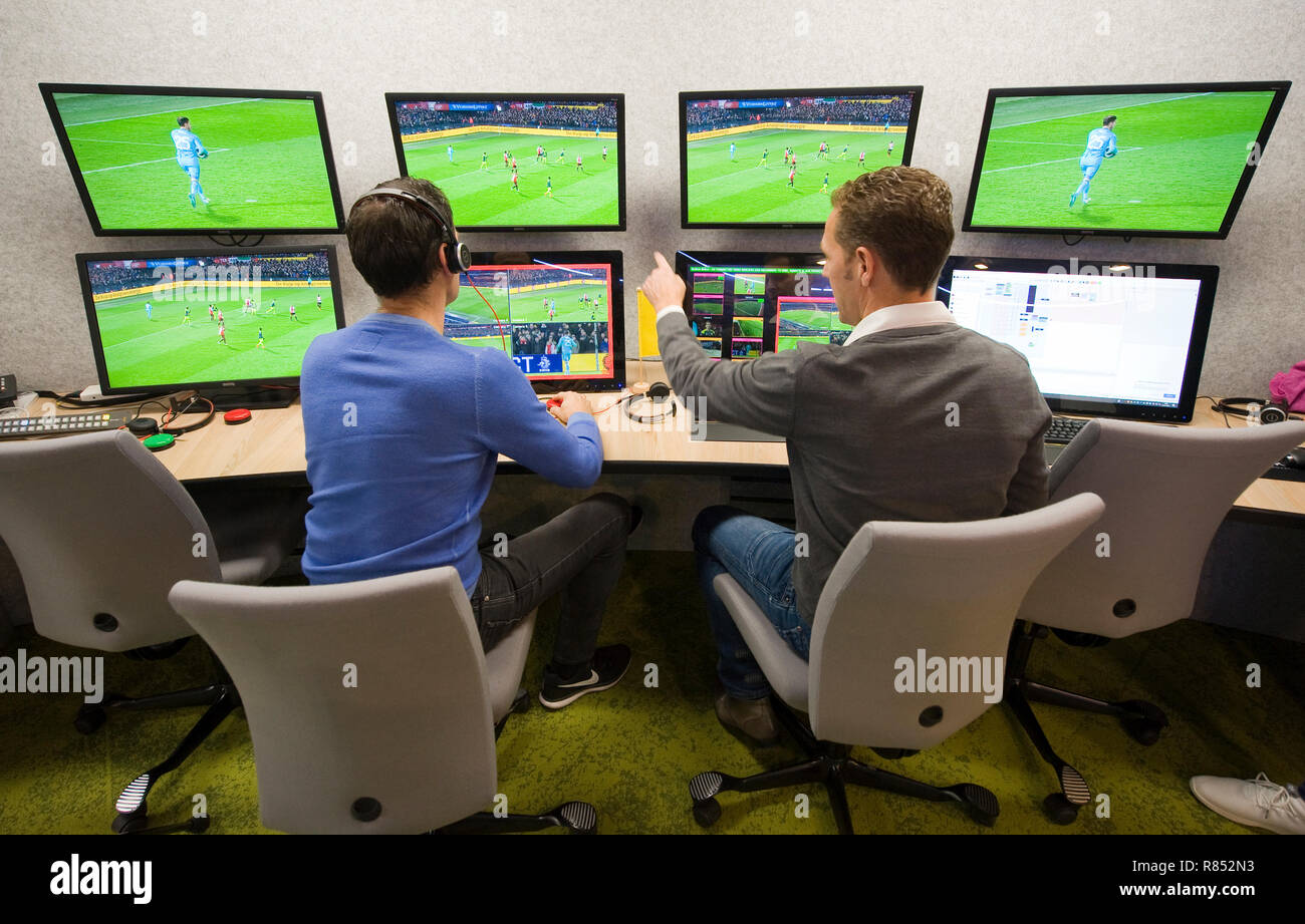 VAR referee Bas Nijhuis (left) and his operator Mike van der Roest (right) working at the VAR center in the headquarters of the Dutch football associa Stock Photo