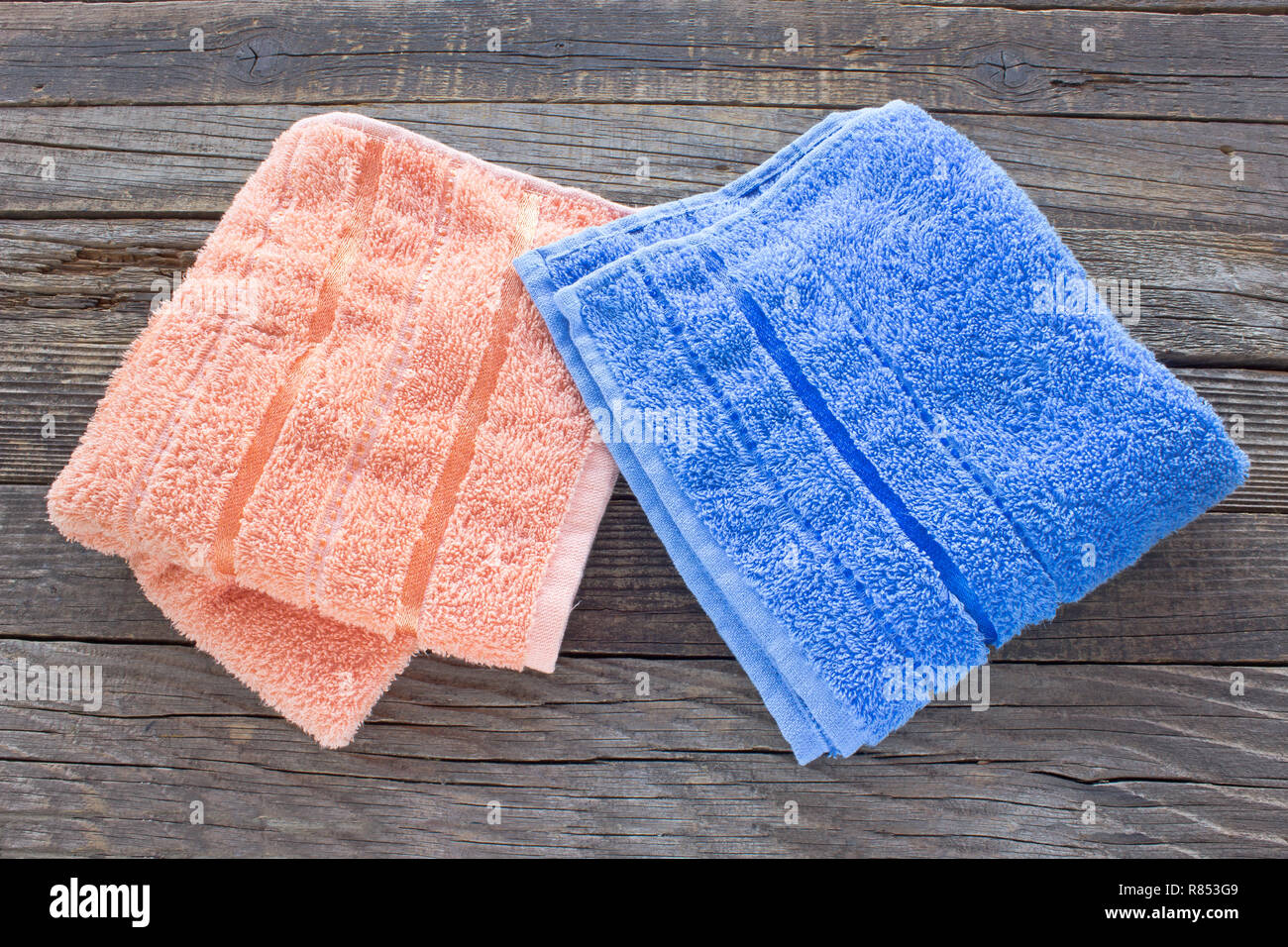 Towels on wooden background Stock Photo