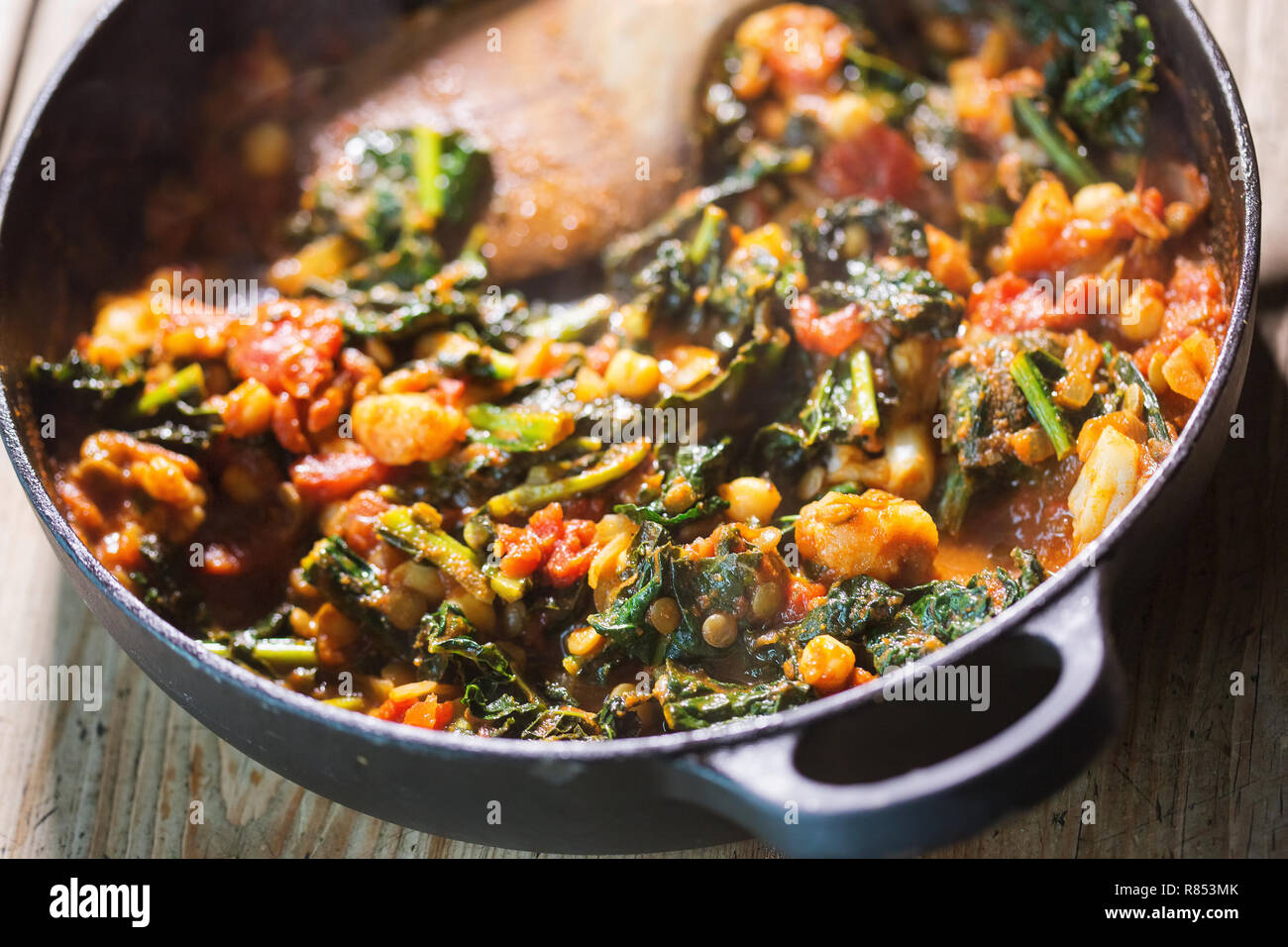 Kale chickpeas curry in tomato sauce Stock Photo Alamy